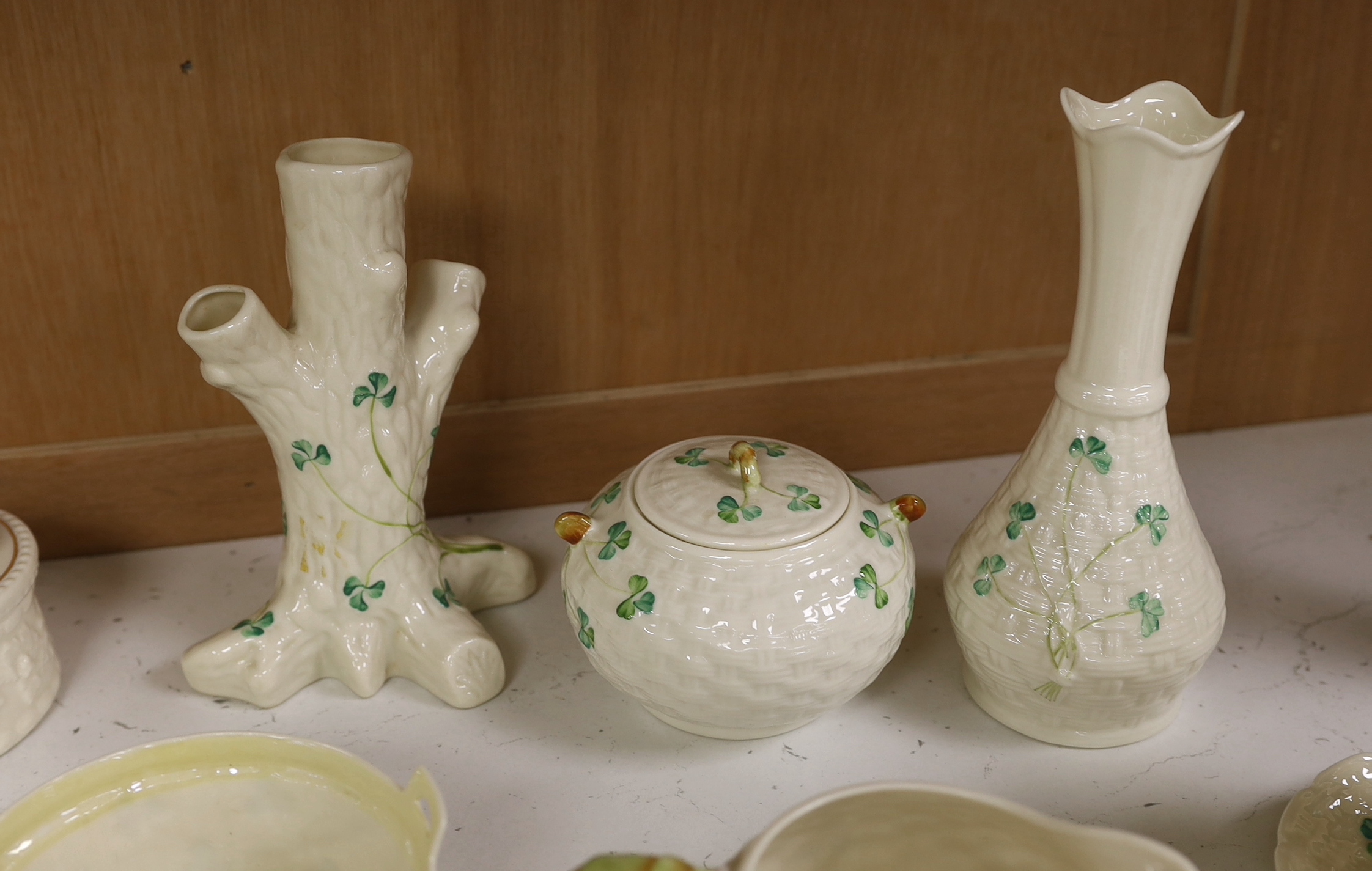 A quantity of Belleek ‘Clover’ pattern ceramics and a Belleek box and cover, tallest 18.5cm